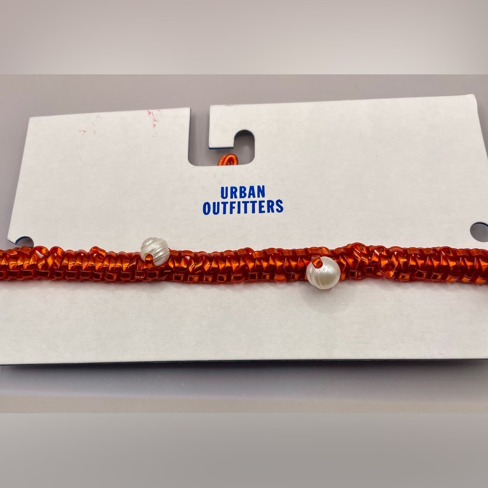 Urban Outfitters Orange woven metallic cord with faux pearl choker necklace.
